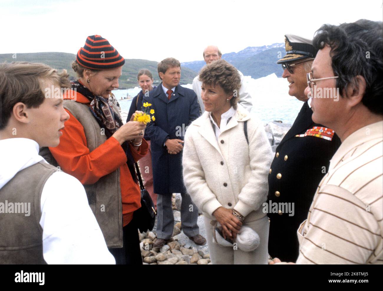 Greenland, Brattalid August 1982. King Olav and Crown Princess Sonja visit Greenland with Queen Margrethe, Prince Henrik, the children Crown Prince Frederik, Prince Joachim of Denmark and President Vigdis Finnbogadottir. Here during the tour at Brattalid (t.v.) Queen Margrethe with flowers, Crown Princess Sonja and King Olav. Photo: Paul Owesen NTB / NTB Stock Photo