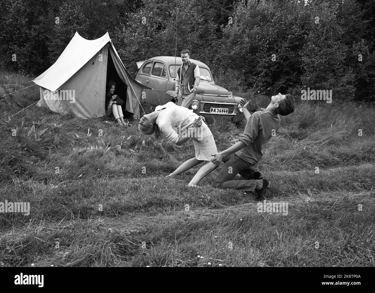 Karlskoga, August 1963, Sweden. 30 - 40,000 young people, including some raggers, take Karlskoga to look at cannon race (car race). Police are meeting strong to keep calm in the city. Here from the campsite where the youth lived in a tent. A couple from Stockholm dances the hottest dance of the time, Twist. Photo: Ivar Aaserud / Current / NTB Stock Photo