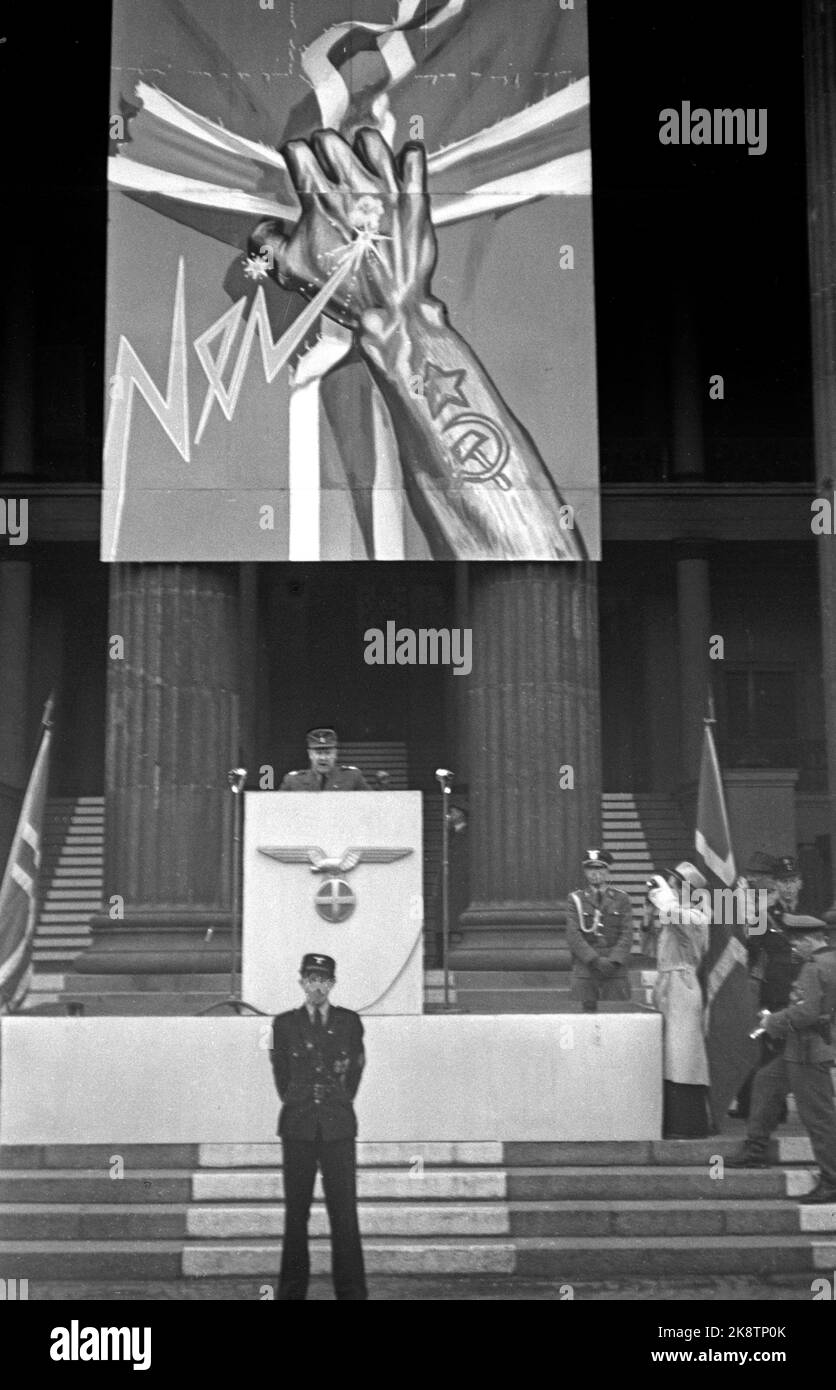 Oslo 19440515 Norway during World War II. Minister President Vidkun Quisling speaks at the University Square in Oslo, against what he calls the traitors in London, and the fight against Bolshevism. Quisling on the pulpit. German eagle and sun cross on the pulpit. In the background, a propaganda poster against Bolshevism. A hand with tattooed Russian symbols, stars, hammer and sickle tears the cross out of the Norwegian flag. Photo: Kihle / NTB / NTB Stock Photo