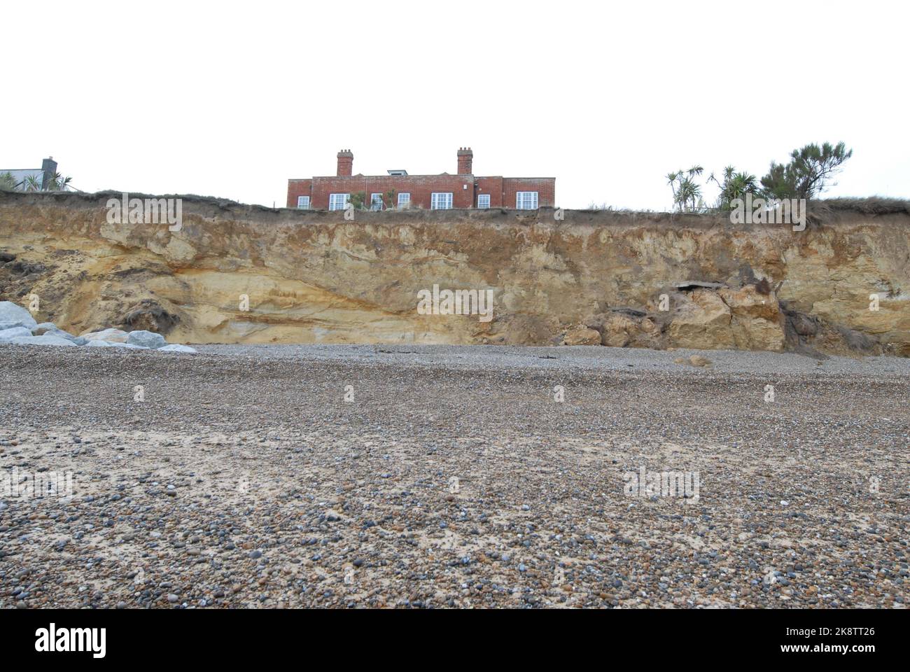 Luxury Red House seen from rear, above cliffs weakened by Coastal Erosion, below North End Avenue, Thorpeness 22nd October 2022 Stock Photo