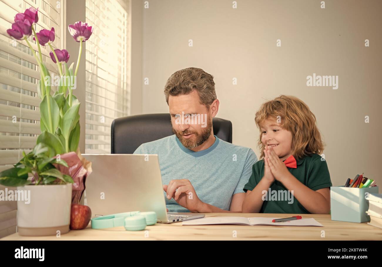 mature man teacher or dad helping kid son with school homework on ...
