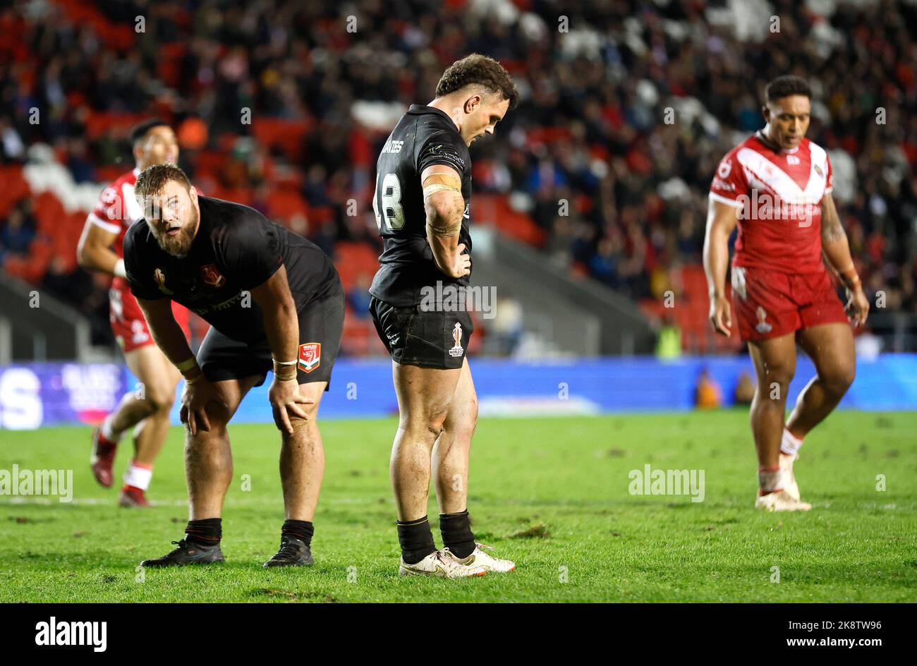 Wales' Connor Davies (centre) looks dejected with team-mate during the ...