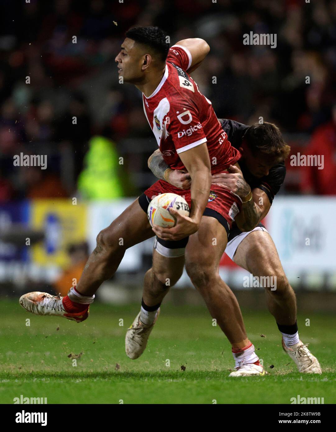 Tonga's Will Penisini (left) and Cook Islands' Kayal Iro in action