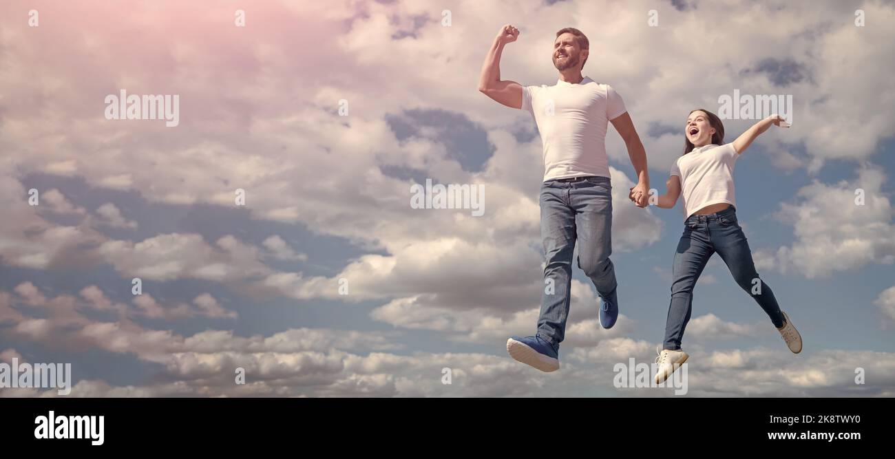Father and daughter jump on sky, banner with copy space. happy father ...