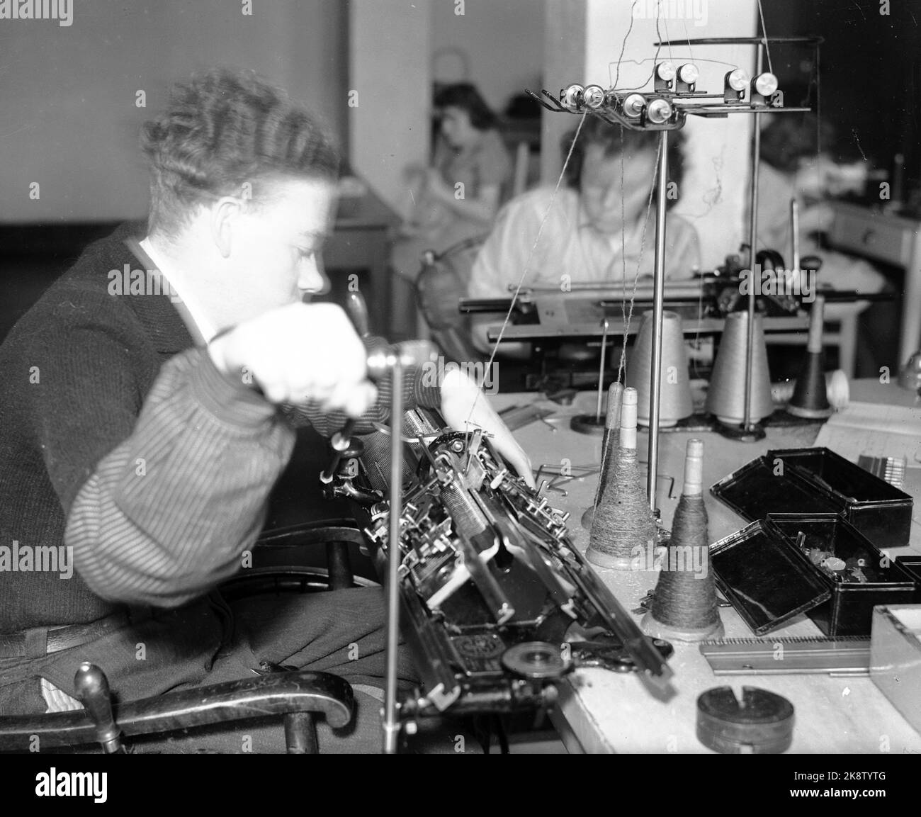 WW2 Oslo 19440418 Sophies Minde. A disabled man works at a sewing