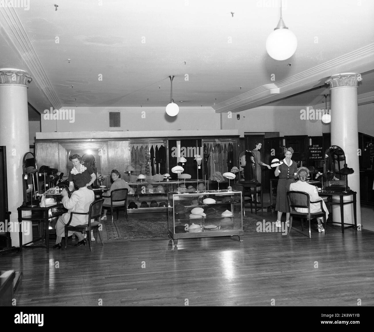 Oslo August 9, 1951. Steen & Strøm has opened a new hat section. Women sit and try hats. Photo; NTB / NTB Stock Photo