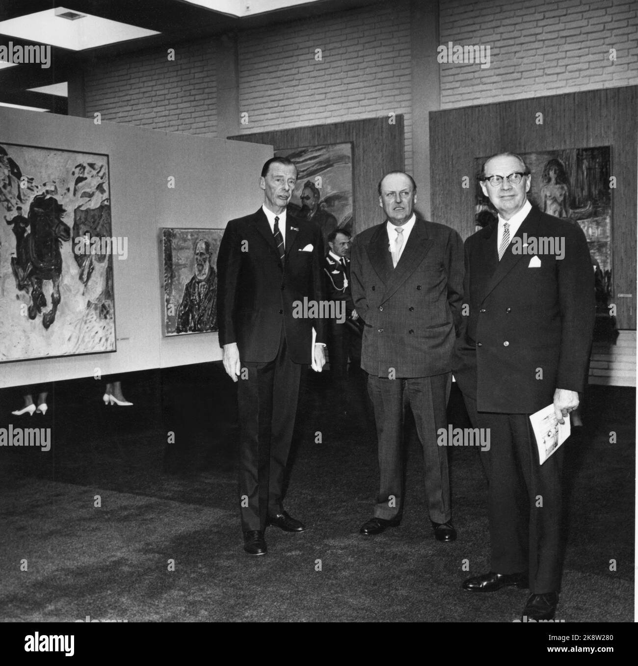 Oslo 19630529 The opening of the Munch Museum. From V: King Olav, director Johan H. Langaard (TV) and Mayor Rolf Stranger on a tour of the painting collection. Photo: Erik Thorberg / NTB / NTB Stock Photo