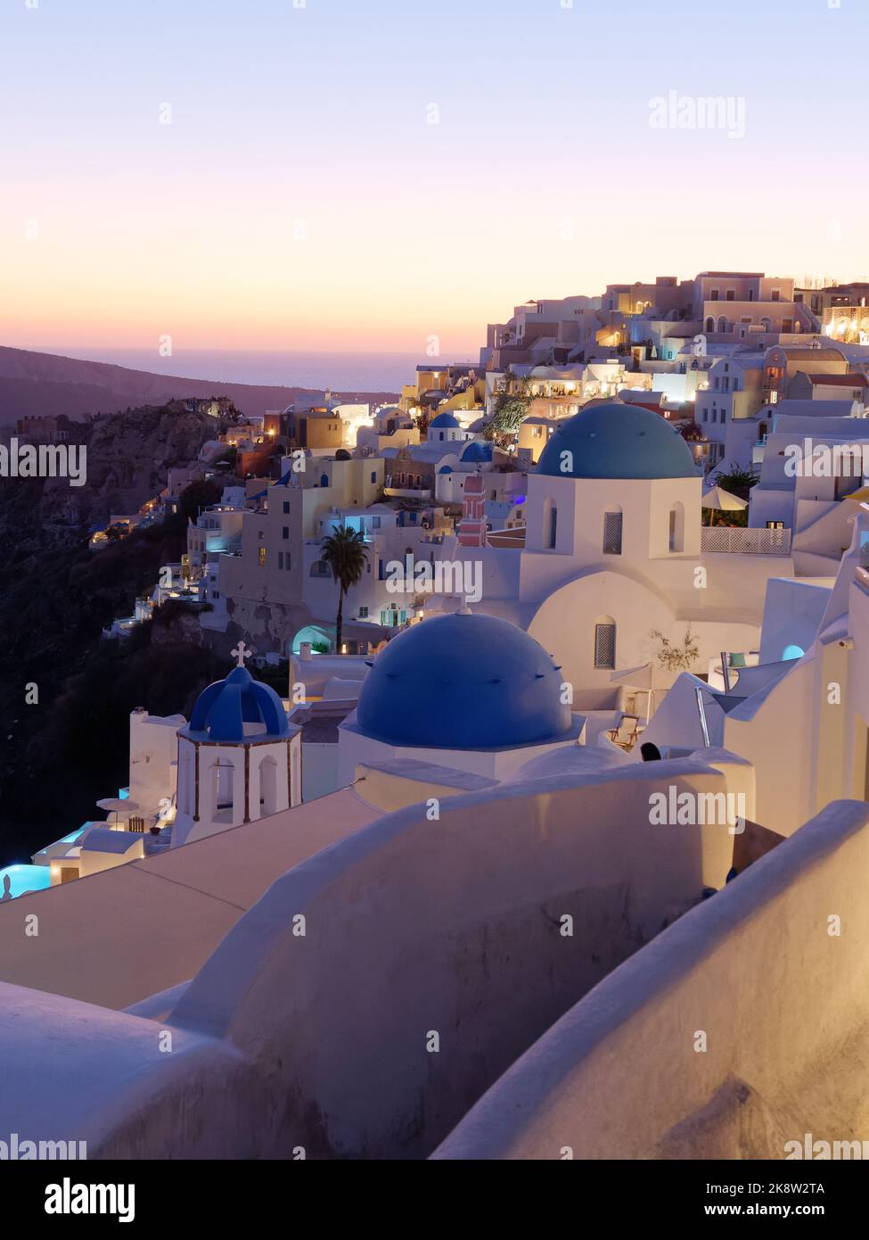 Town of Oia with blue domed churches and Caldera view. Greek Cyclades