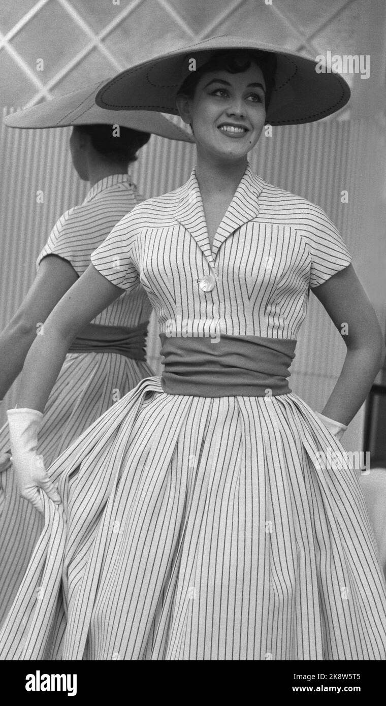 Oslo 19560223. Spring and summer fashion 1956. Mannequin show of Norwegian -produced women's fashions. White dress with black stripes, wide red fabric belt and ball hat. Photo: Aage Storløkken / Kaare Nymark / NTB Stock Photo