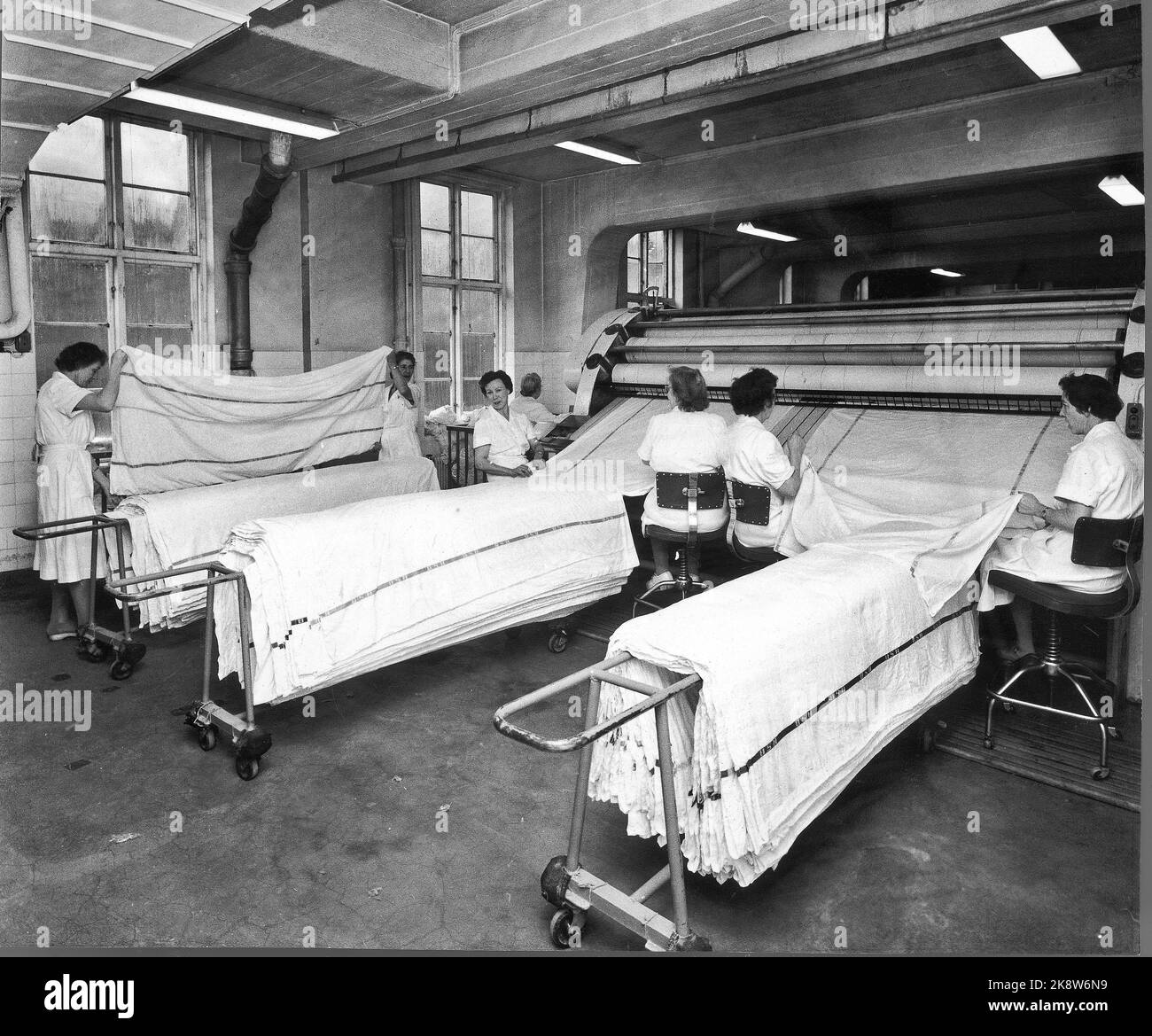 Oslo 19600106: In 1960, NSB had 3212 beds in their sleeping wagons, and they became increasingly popular. Every day, an army of cleaners moved into NSB's area in Lodalen, to wash, clear and change bedding. The bedding is washed at NSB's laundry in Lodalen, which in 1959 handled 1.5 million kilos of clothes only from the sleeping cars. This corresponds to about 300,000 bed shifts in one year. Around Christmas there are often 3000 sheets per day! Photo: Ivar Aaserud / Current / NTB Stock Photo