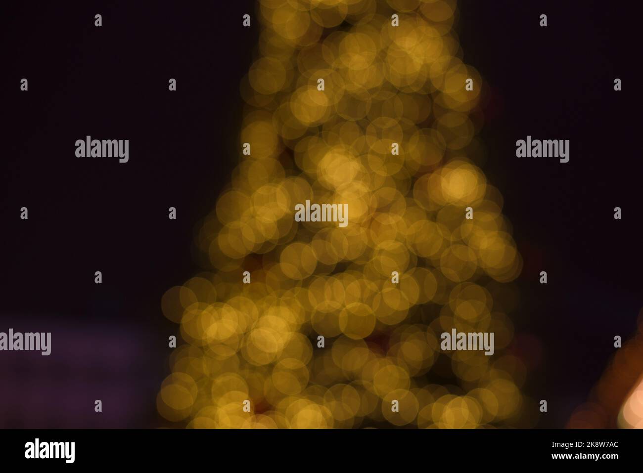 Christmas trees lights. Christmas garland blurred out. Defocused Photo. Stock Photo