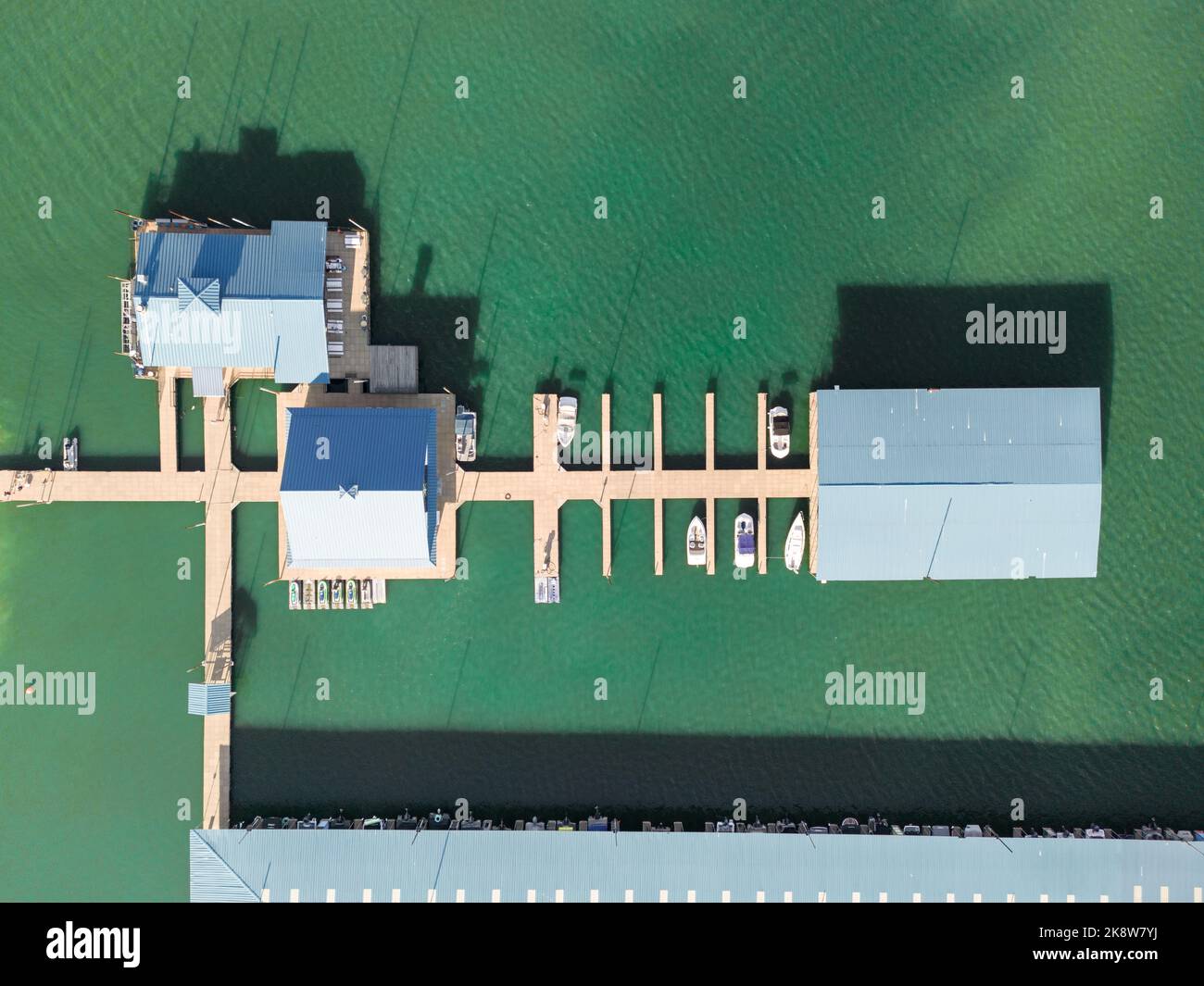 Aerial top down view of boat dock and yacht port, boats are moored on