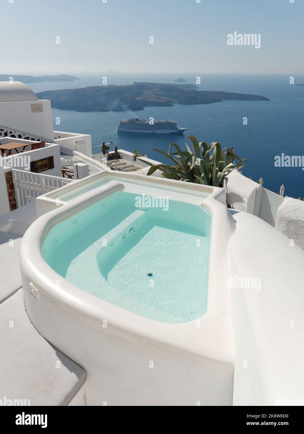 Plunge pool with Caldera views including a cruise ship. Greek Cyclades island of Santorini in the Aegean Sea Stock Photo