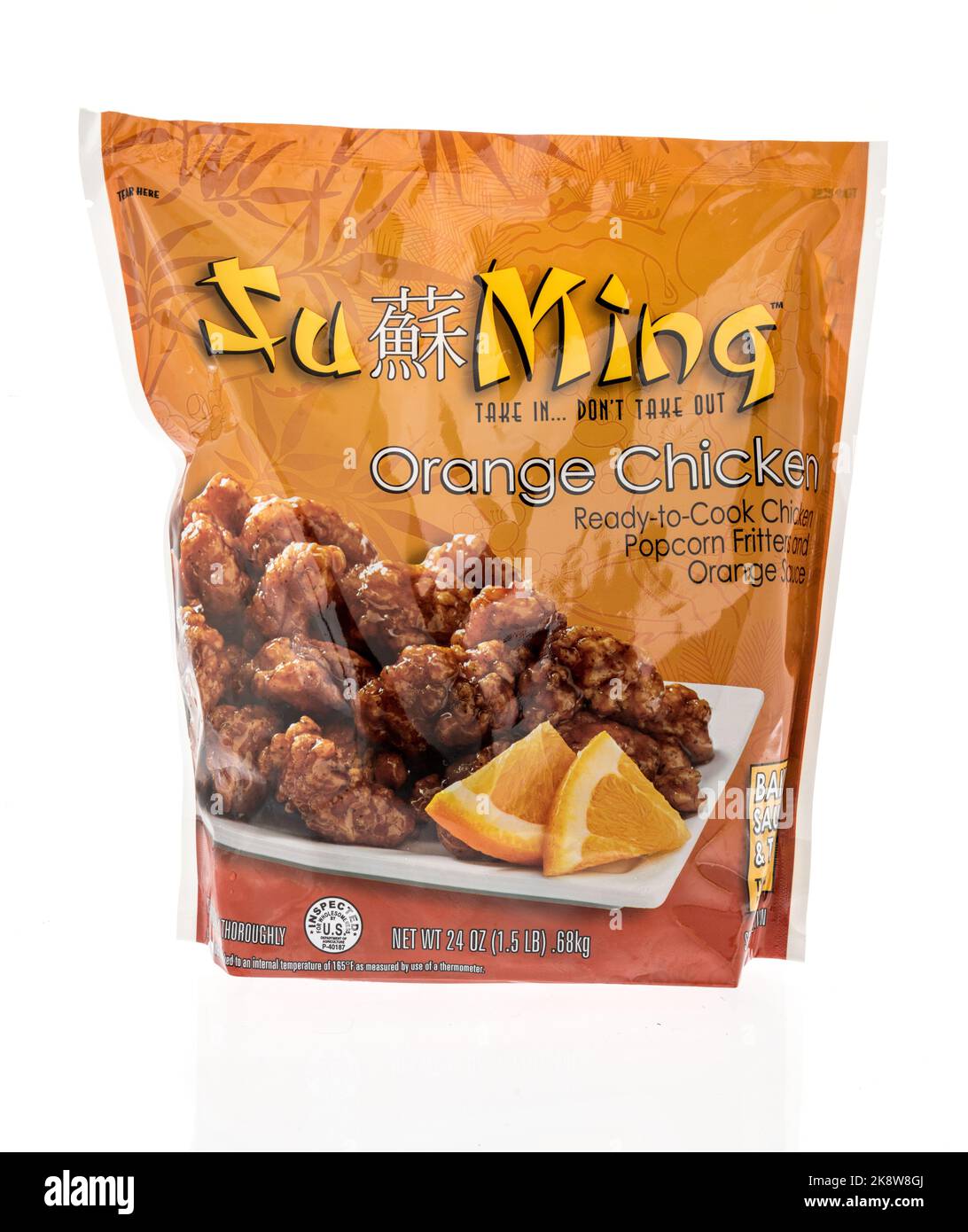 Winneconne, WI - 26 September 2022: A package of Ju Ming orange chicken on an isolated background. Stock Photo