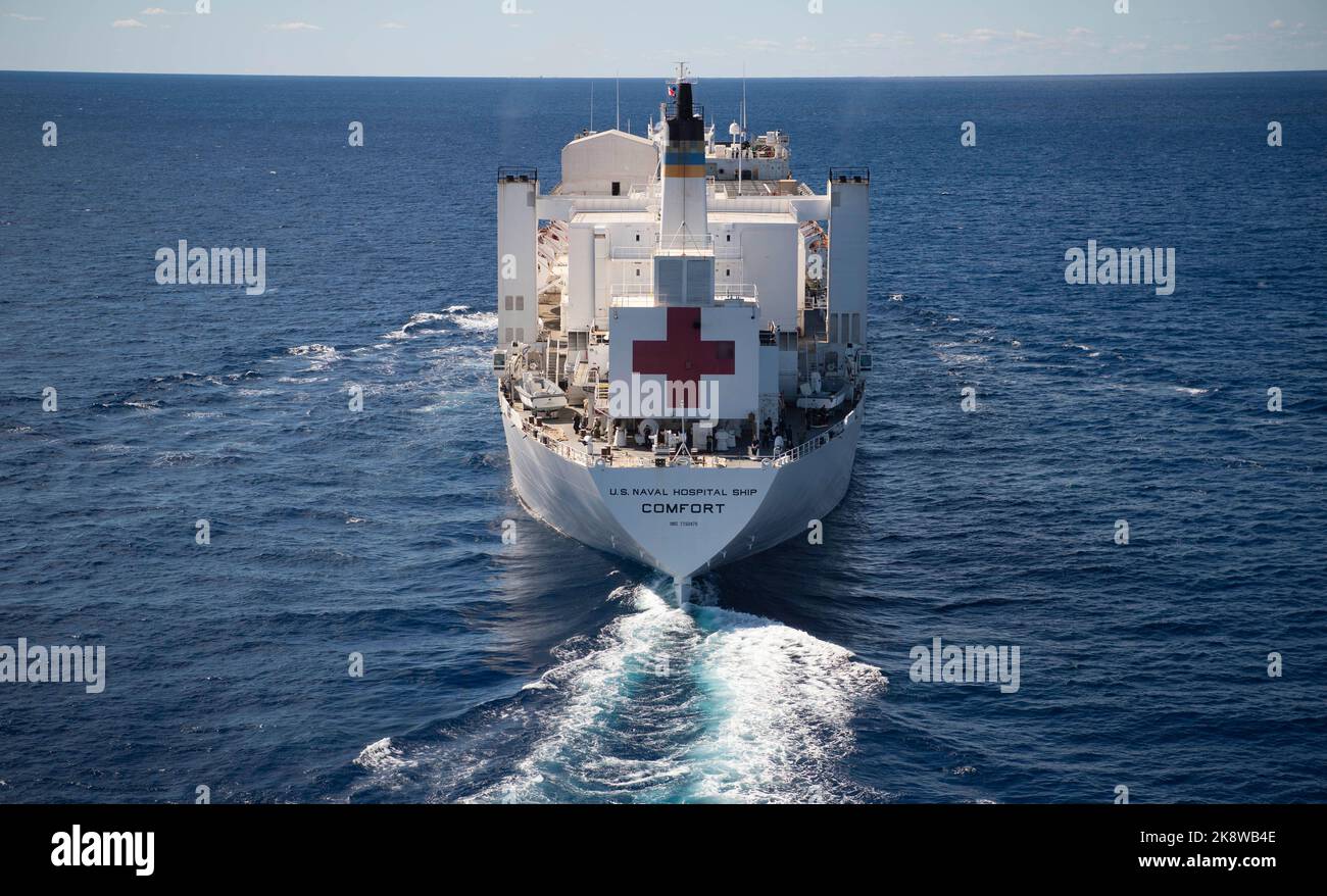 221021-N-MY642-1179  ATLANTIC OCEAN (October 21, 2022) The hospital ship USNS Comfort (T-AH 20) steams through the ocean as part of the transit south from Nofolk, Va. Comfort is deployed to U.S. 4th Fleet in support of Continuing Promise 2022, a humanitarian assistance and goodwill mission conducting direct medical care, expeditionary veterinary care, and subject matter expert exchanges with five partner nations in the Caribbean, Central and South America. (U.S. Navy photo by Mass Communication Specialist 1st Class Donald R. White Jr.) Stock Photo