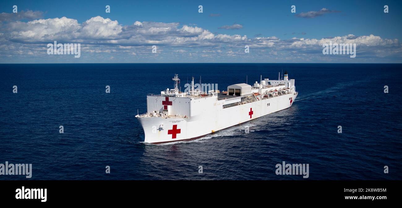 221021-N-MY642-1048  ATLANTIC OCEAN (October 21, 2022) The hospital ship USNS Comfort (T-AH 20) steams through the ocean as part of the transit south from Nofolk, Va. Comfort is deployed to U.S. 4th Fleet in support of Continuing Promise 2022, a humanitarian assistance and goodwill mission conducting direct medical care, expeditionary veterinary care, and subject matter expert exchanges with five partner nations in the Caribbean, Central and South America. (U.S. Navy photo by Mass Communication Specialist 1st Class Donald R. White Jr.) Stock Photo