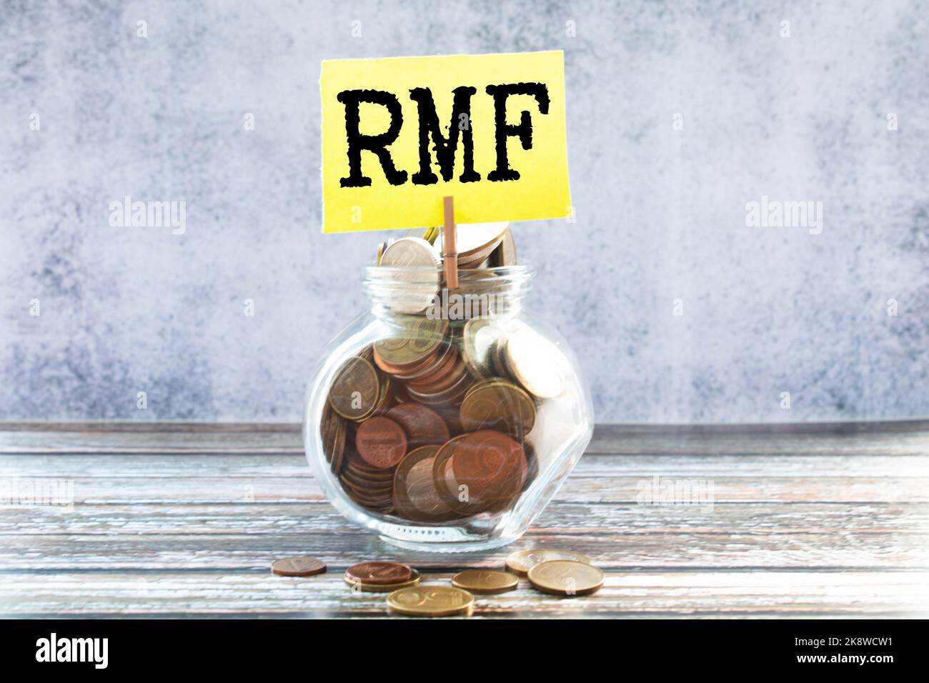 Businessman hand with pen pointing to RMF sign on the paper. Stock Photo