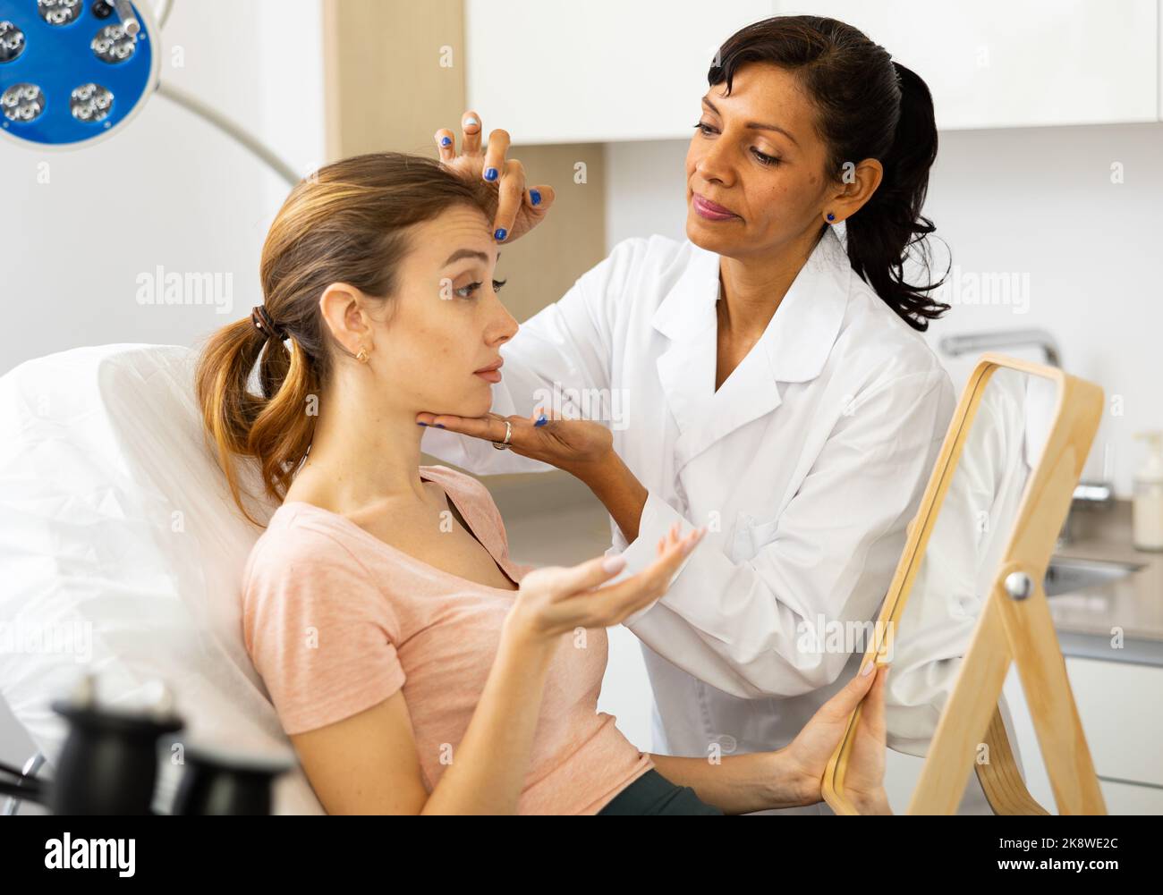 Woman having consultation at aesthetic medicine clinic Stock Photo