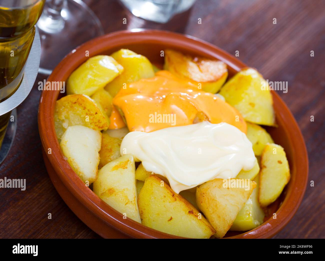 Patatas bravas with garlic mayonnaise and sauce Stock Photo Alamy