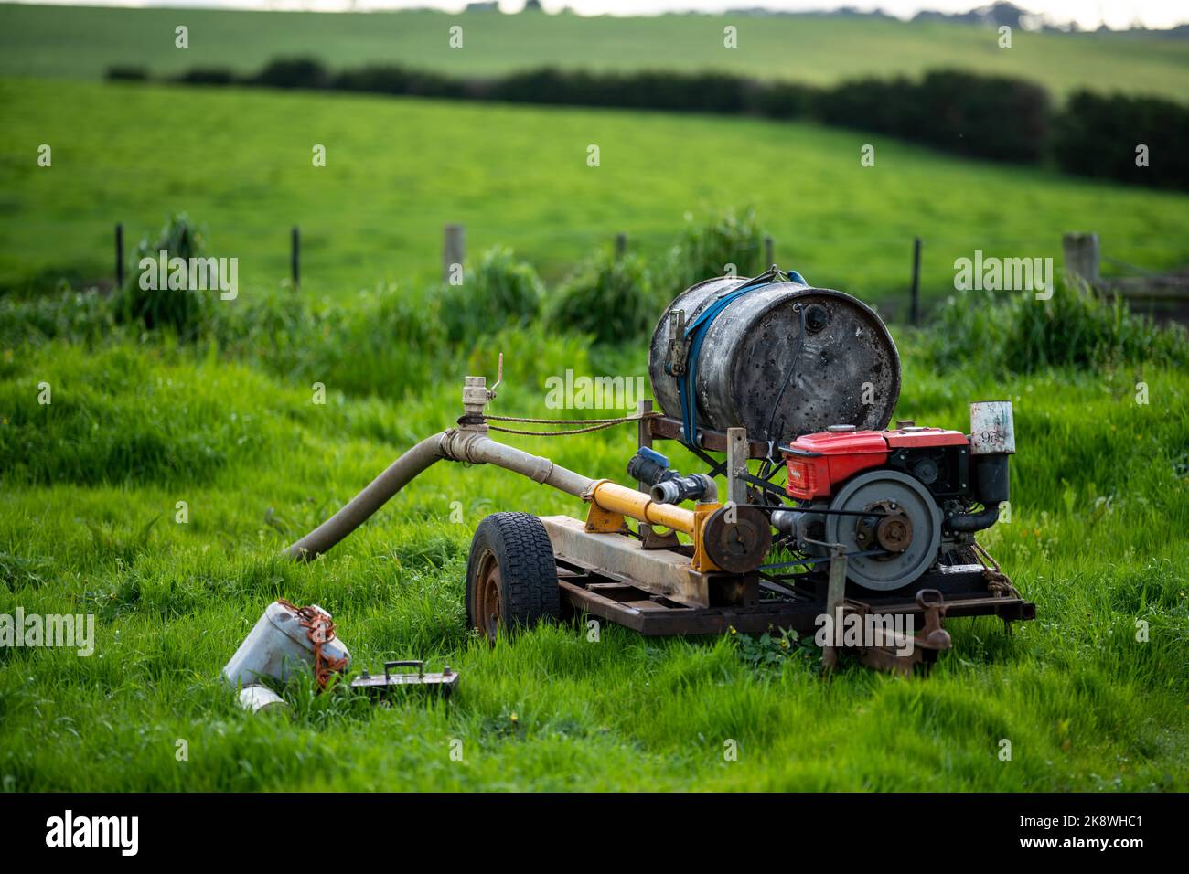 water pump, pumping water on a farm in summer. irrigation on a ranch in