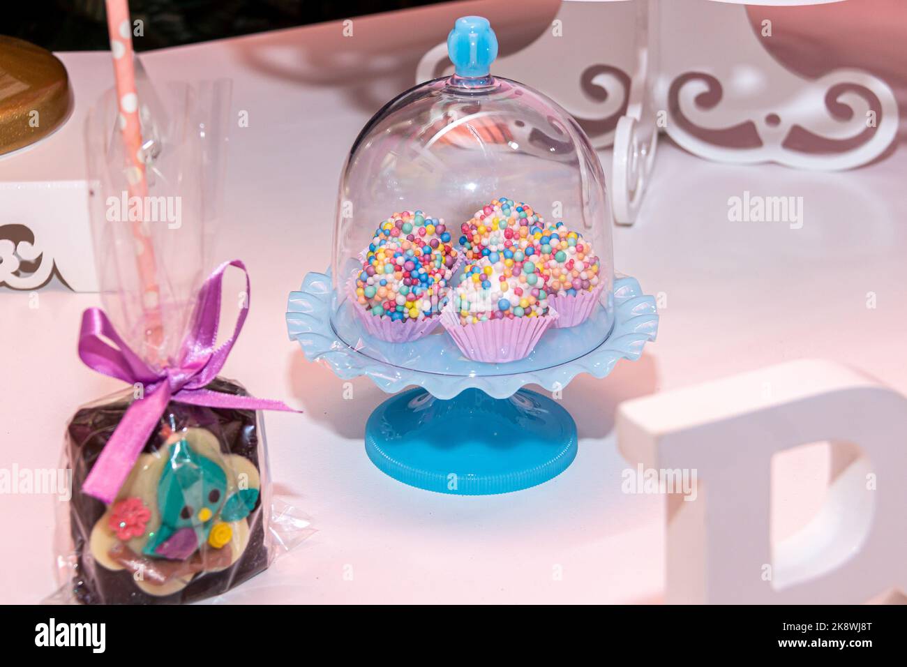 Table with children's birthday party decoration with objects and