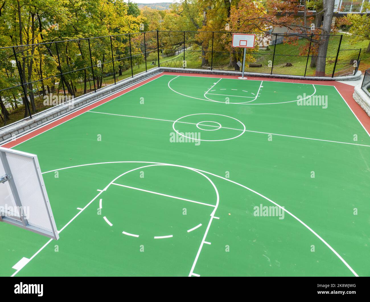 Aerial photo of a green and red outdoor basketball court at school ...