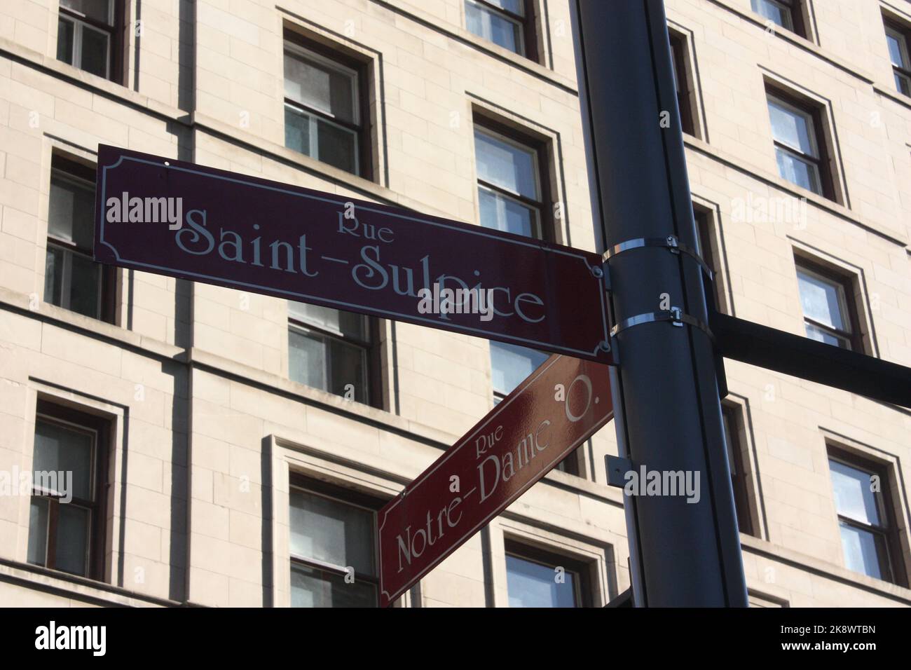 A signpost at the intersection of Rue SaintSulpice and Rue NotreDame