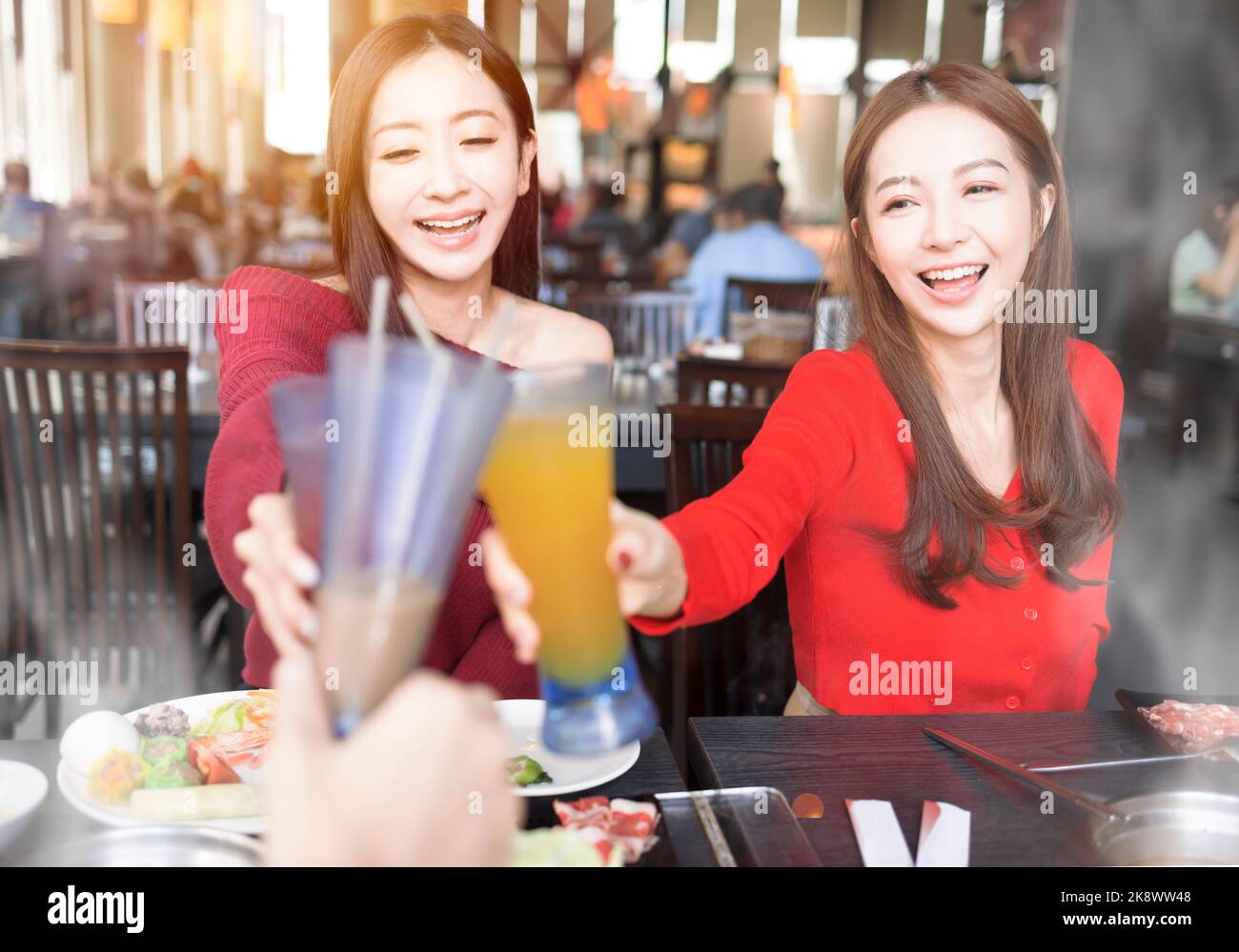 Young people toasting and celebrating  at  restaurant Stock Photo