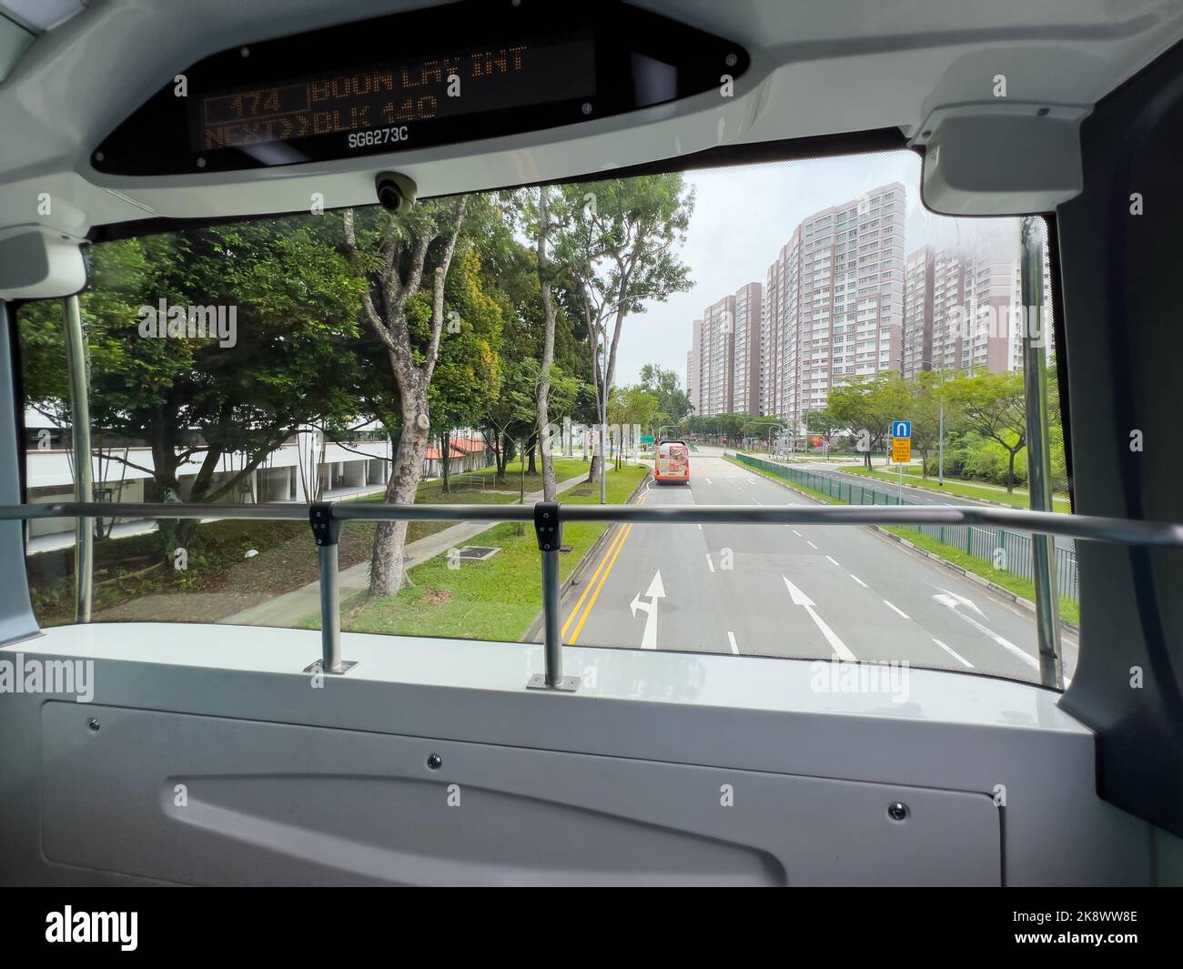 Inside a double decker bus, the upper deck front seat offer a wide view of the public area during the bus journey. Singapore. Stock Photo