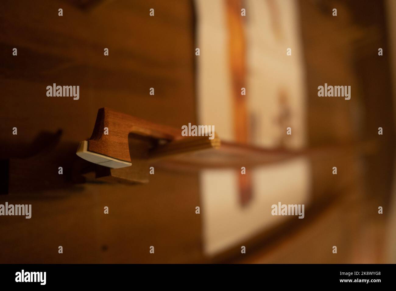 luthier working on bow plate with chisel Stock Photo - Alamy