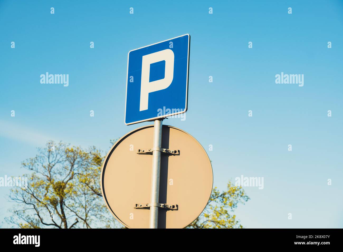 Parking sign showing free places. Traffic parking sign with clean sky