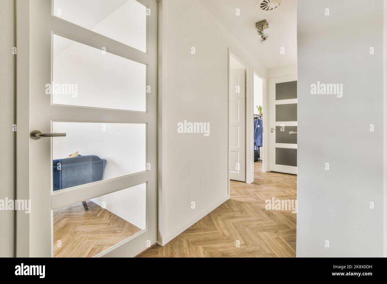 Interior of minimalist style narrow hallway with wardrobe and