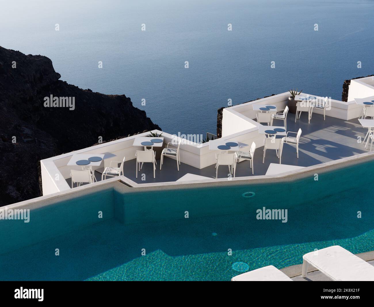 Luxury hotel swimming pool view over the Caldera. Aegean Cyclades Island of Santorini, Greece. Stock Photo