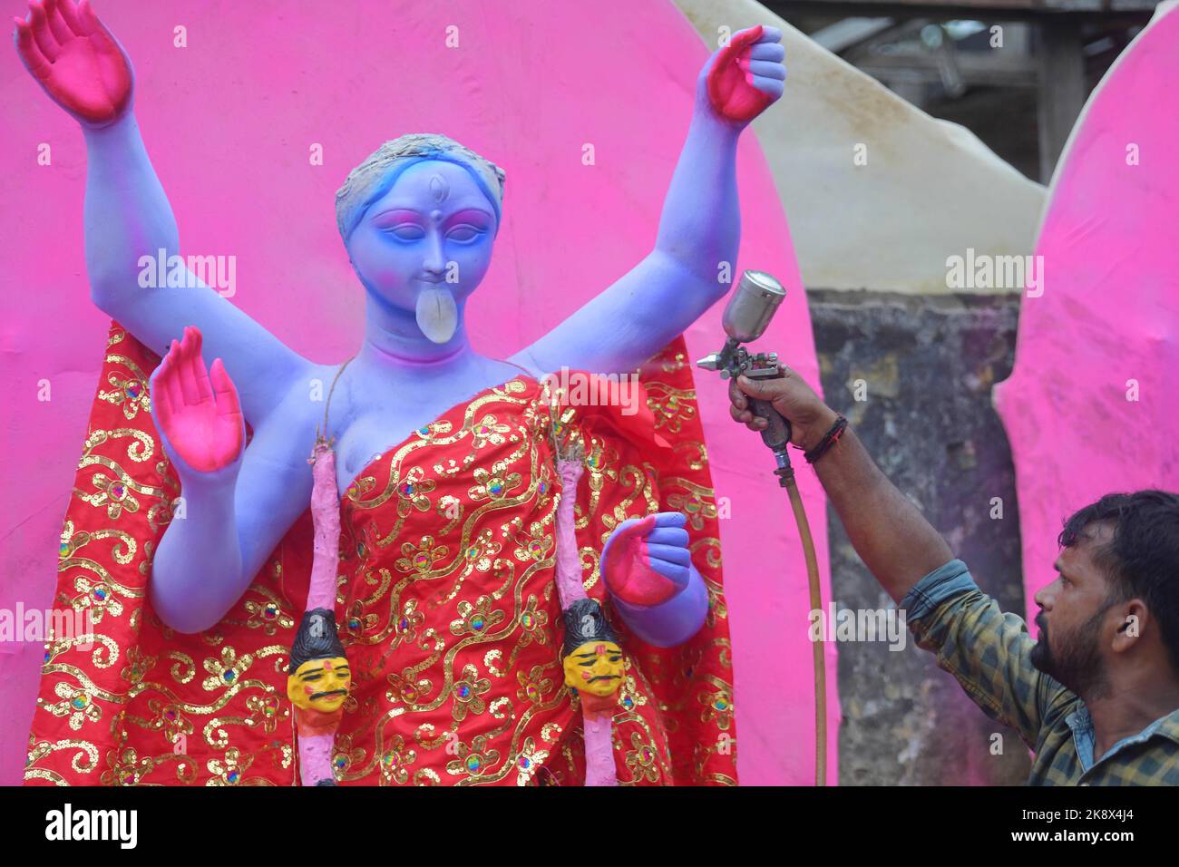 Kali Rama An artisan doing the finishing touches to a semi-finished clay idol of ...