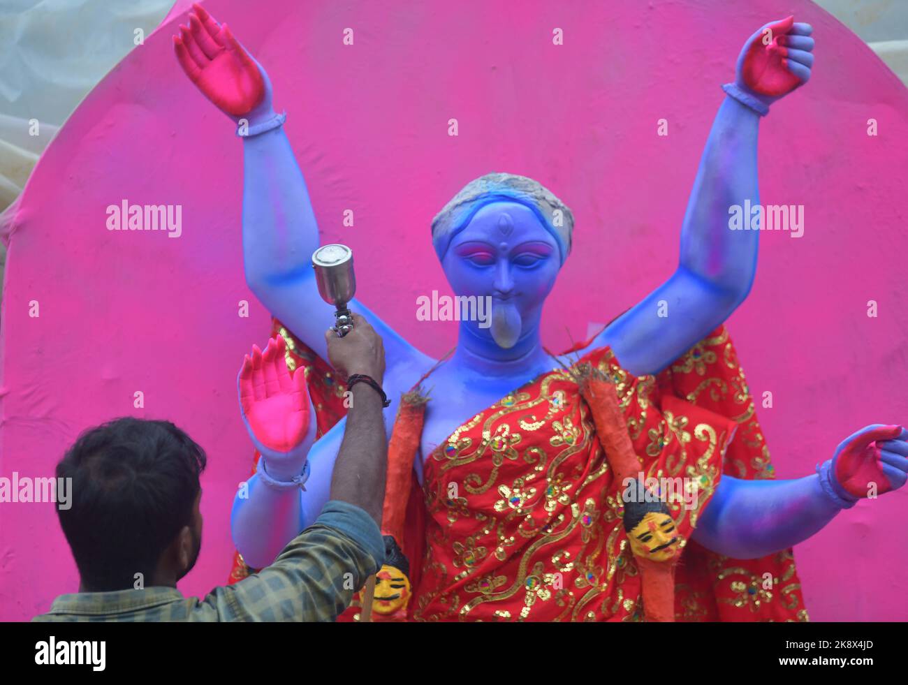 Kali Rama An artisan doing the finishing touches to a semi-finished clay idol of ...