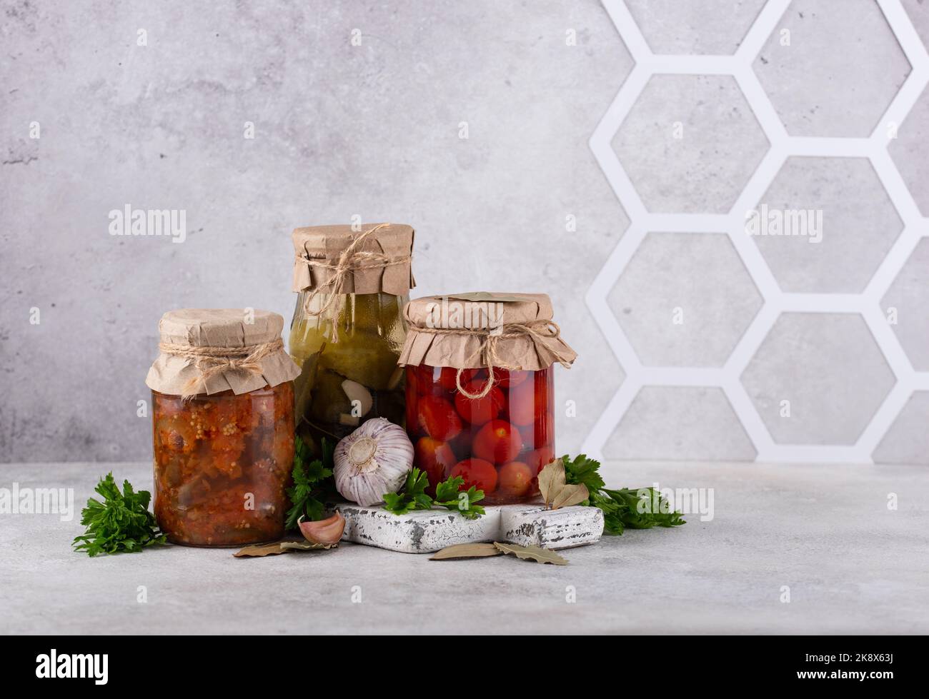 Pickled vegetables in glass jars. Stock Photo