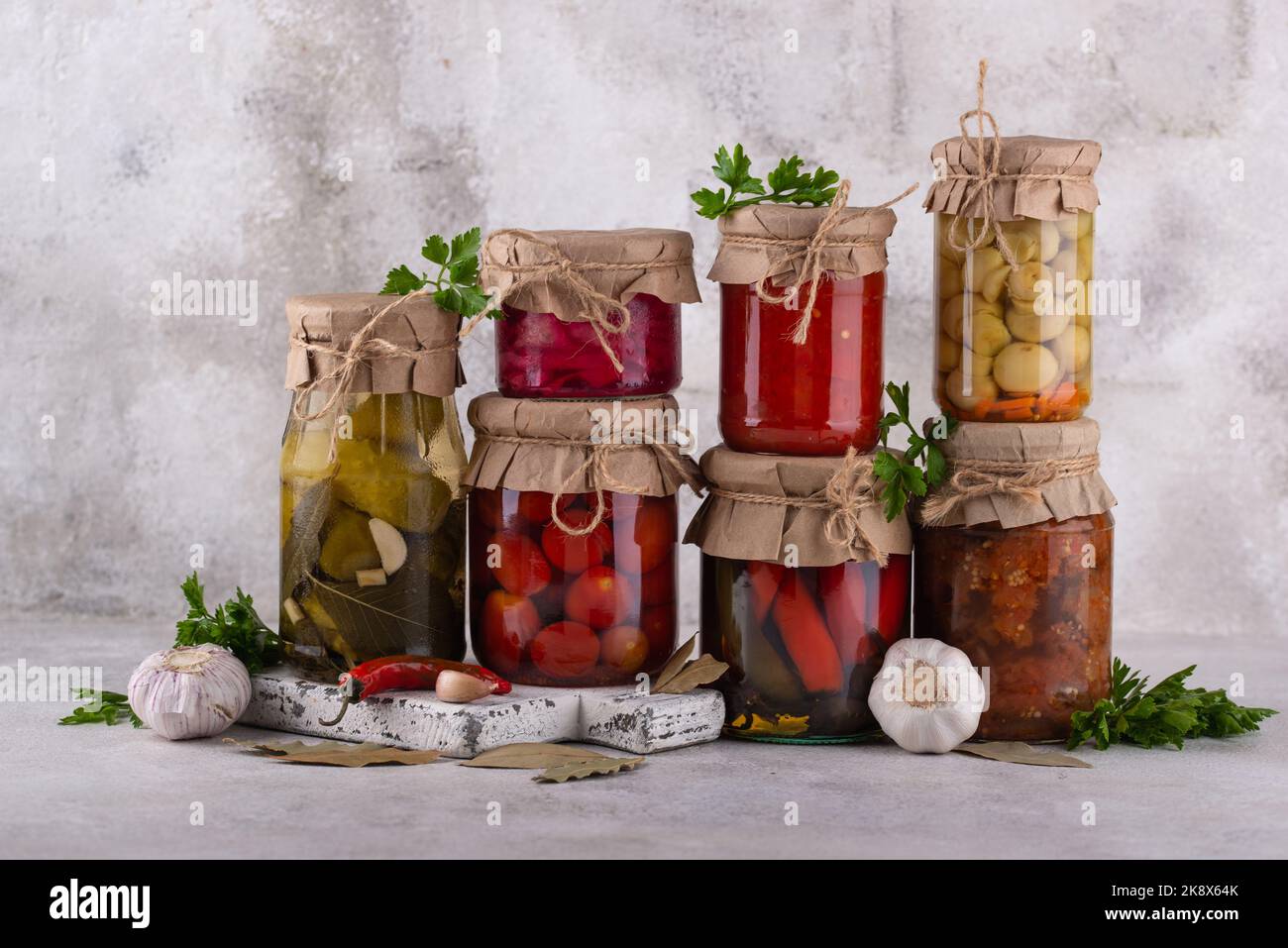 Pickled vegetables in glass jars. Stock Photo