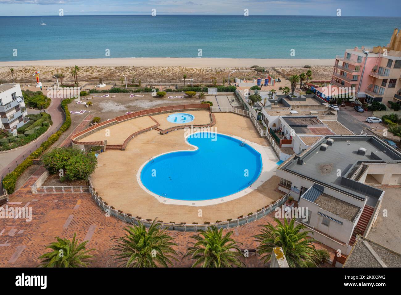 A high level view of a swimming pool in Le Barcares, South of France. Stock Photo