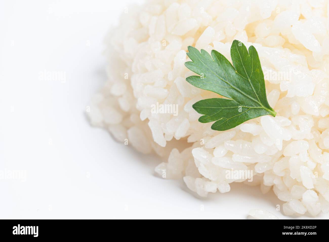 boiled rice with parsley isolated on white background Stock Photo - Alamy