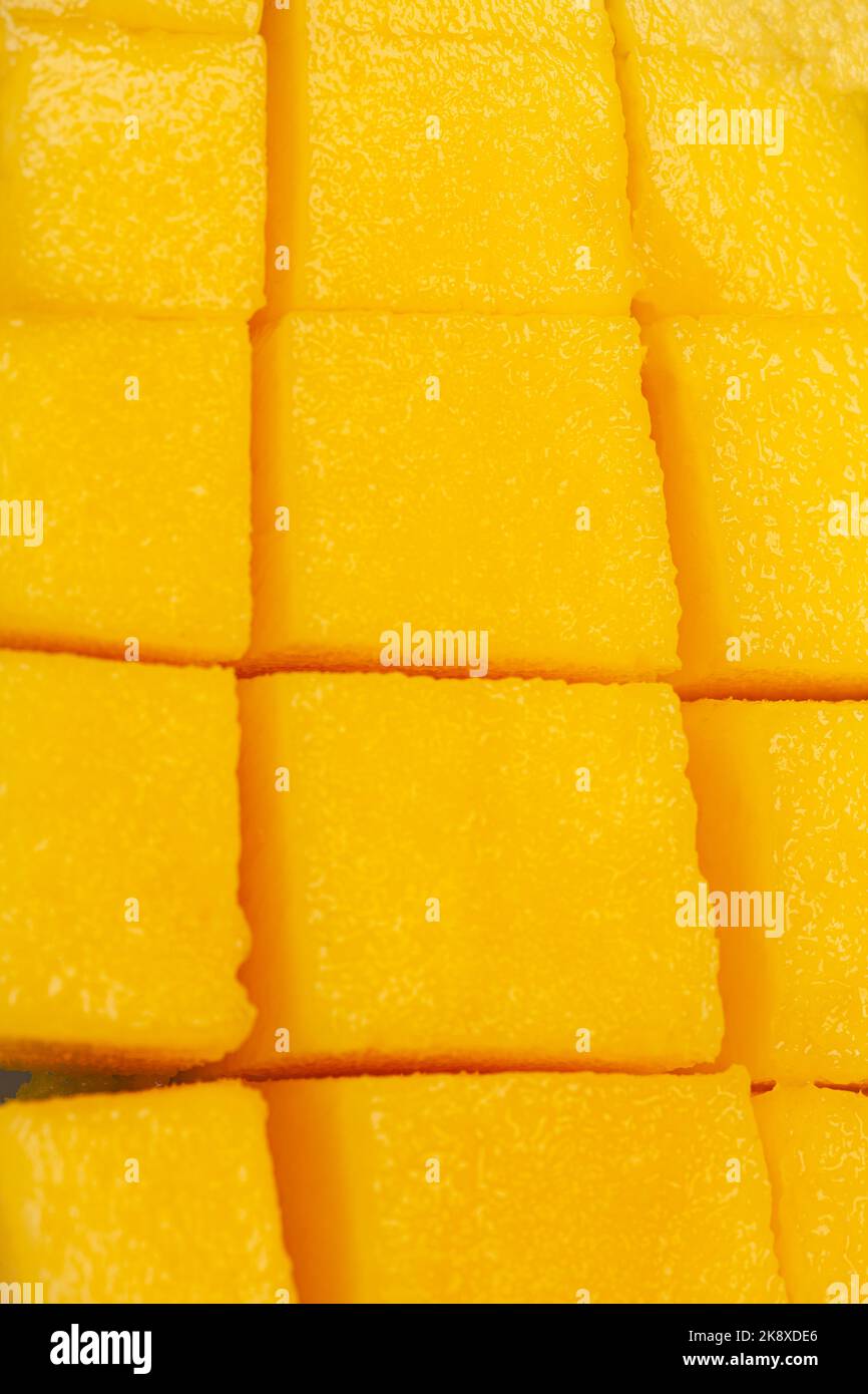 chopped half of ripe mango fruit texture background close-up Stock ...