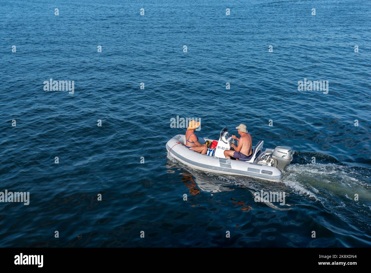 Man and woman in a dinghy on the Veerse Meer, Veere, Zeeland, Netherlands, Europe | Man and woman in a dinghy on the Veerse Meer in front of Veere. Ve Stock Photo