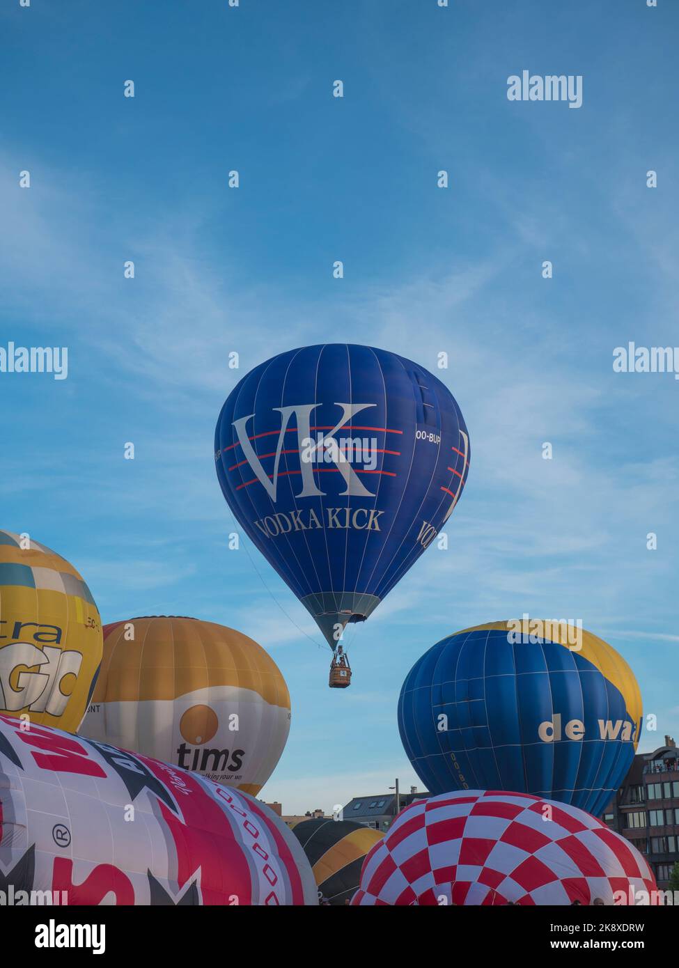 Sint Niklaas, Belgium, 04 September 2022, The hot air balloon Vodka Kick rises among other hot air balloons, on the market of Sint Niklaas Stock Photo
