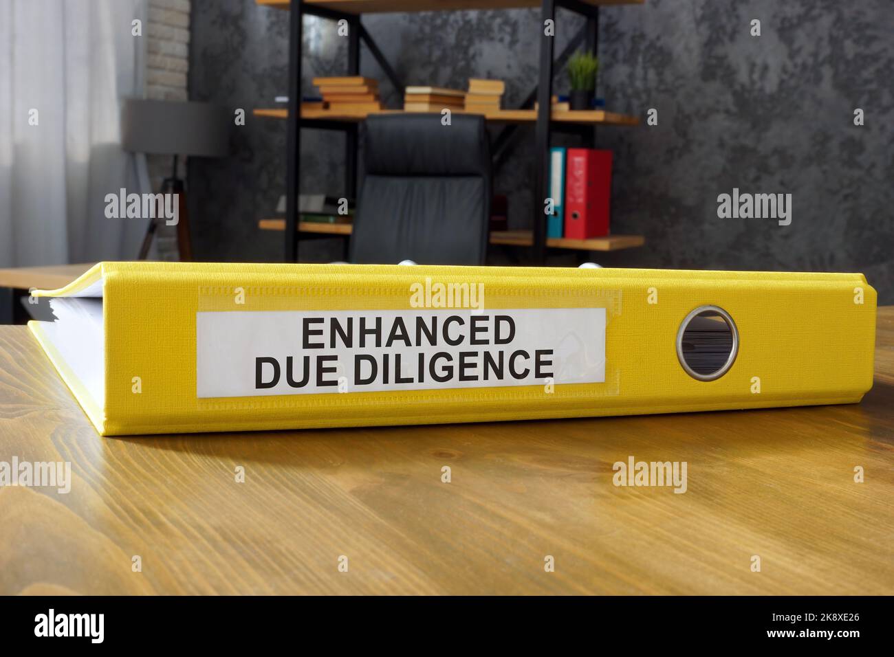 Folder with papers about enhanced due diligence. Stock Photo