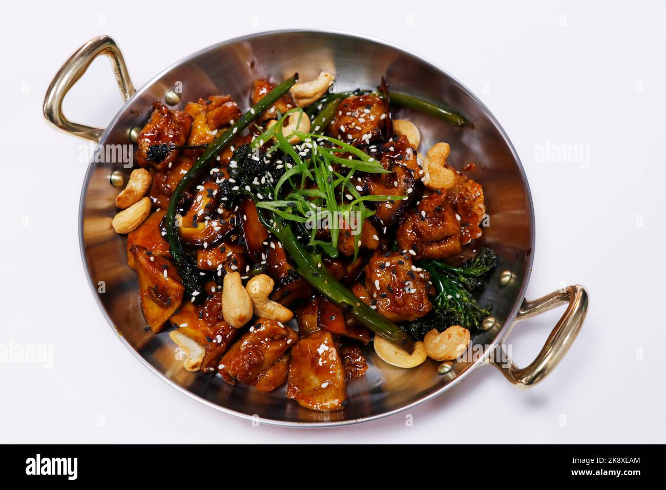 wok fried chinese chicken with broccoli, bok choy and cashew nut in soy