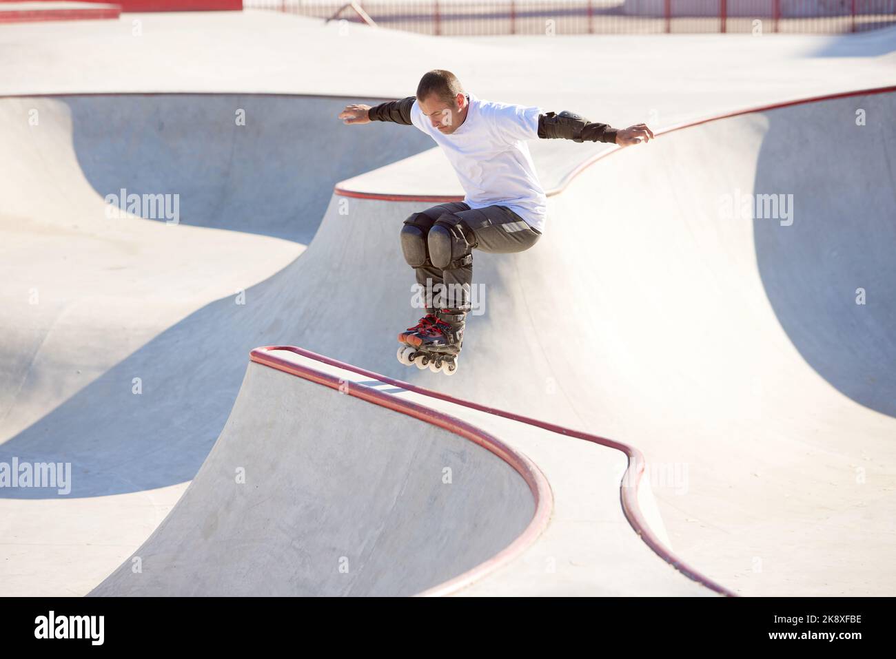 One man, male roller skater on rollerblades training at modern skate
