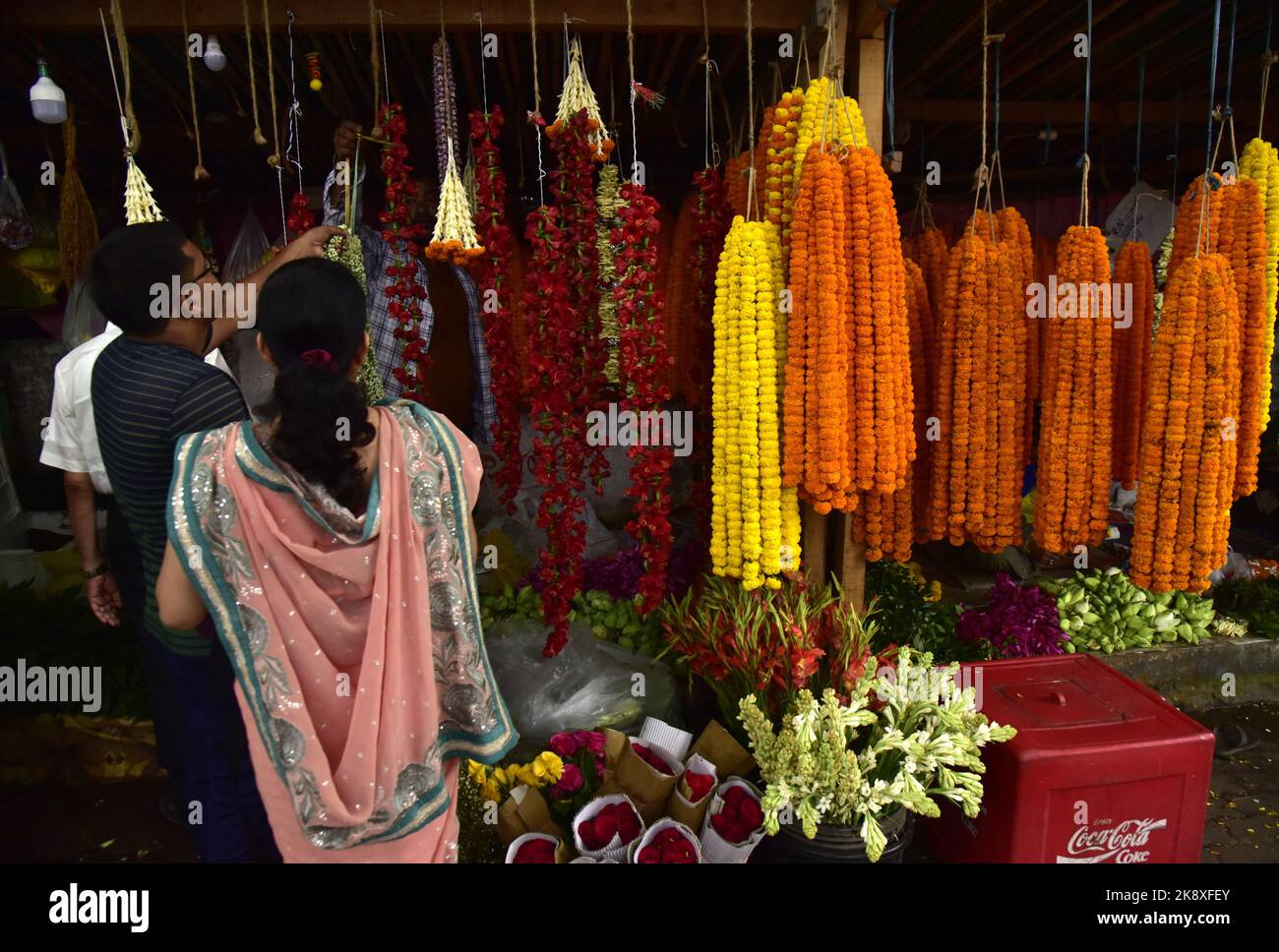 Guwahati, Guwahati, India. 24th Oct, 2022. People buys flowers on the