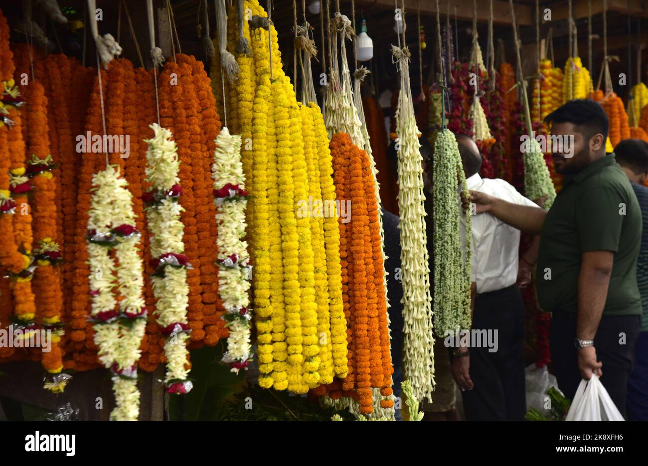 Guwahati, Guwahati, India. 24th Oct, 2022. People buys flowers on the