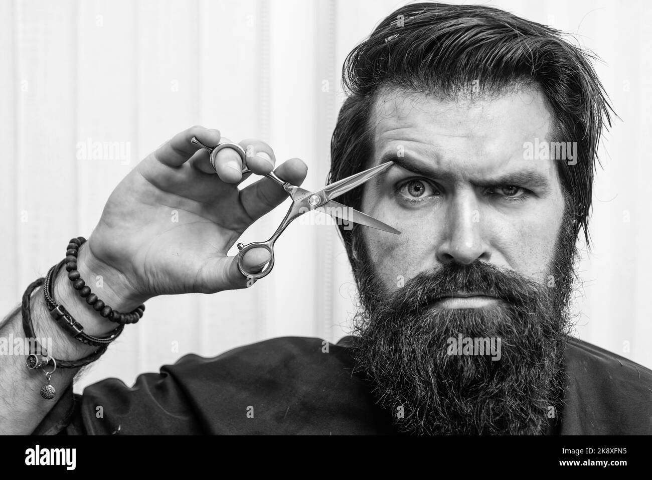 hair cut and beard care for caucasian guy in haircare Stock