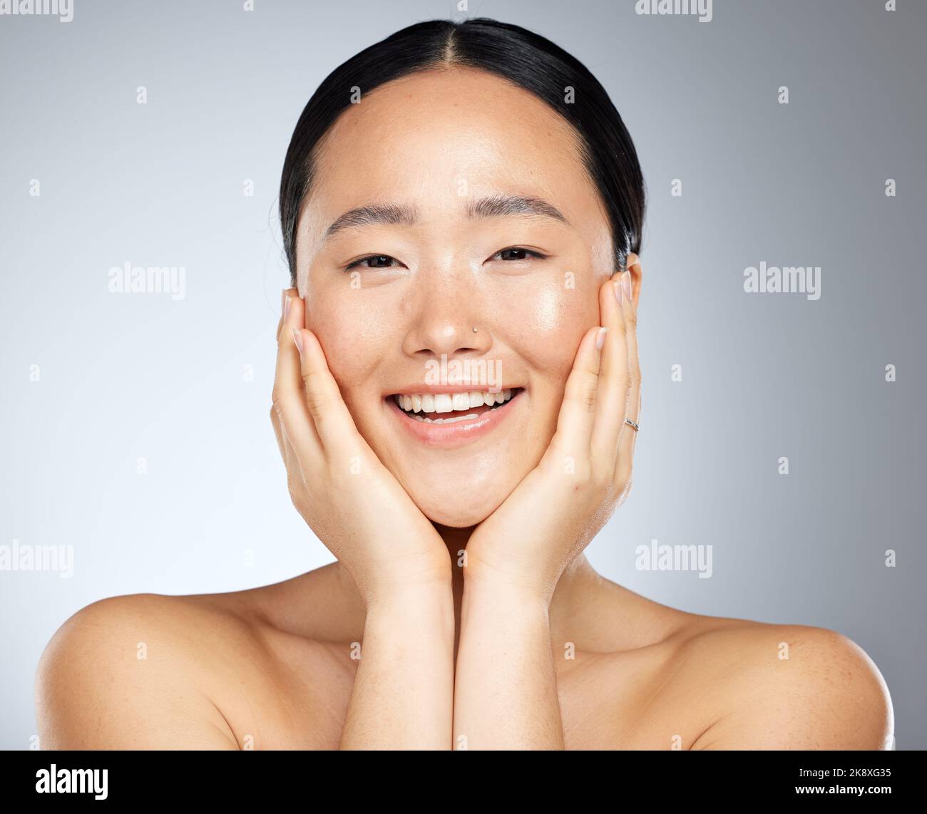Cosmetics, asian woman and facial care for natural beauty, wellness and smile being happy, studio background and healthy. Portrait, makeup and organic Stock Photo