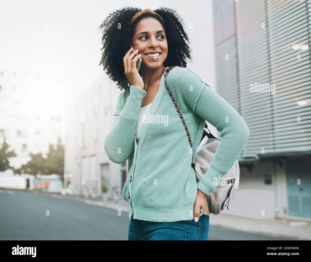 Backpack, phone call and student in city street walking to university ...